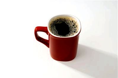 Picture Of Red Ceramic Coffee Mug With Black Coffee