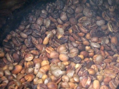 coffee beans turning brown in the middle of roasting process